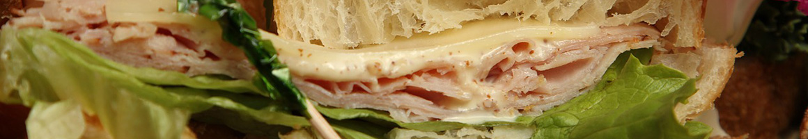 Eating Sandwich Cheesesteak at Hero's Cheesesteak & Subs restaurant in Yorktown, VA.